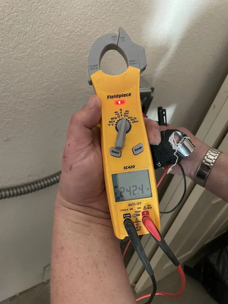Voltage testing with clamp meter during Ceiling Fan Installation in Oakdale